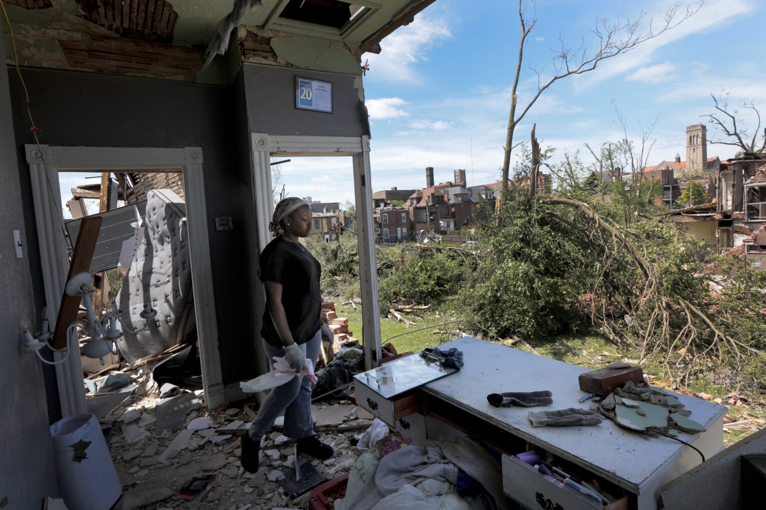 Deadly Storms Strike Midwest and South, Leaving 26 Dead So Far (Photo: "I have never seen anything like this," said Jerikah McCloud, 23, who looks out the destroyed second floor of her family home in the Academy neighborhood of St. Louis, Mo., on Saturday, May 17, 2025, after the National Weather Service confirmed a tornado struck the city on Friday. (Laurie Skrivan/St. Louis Post-Dispatch via AP)