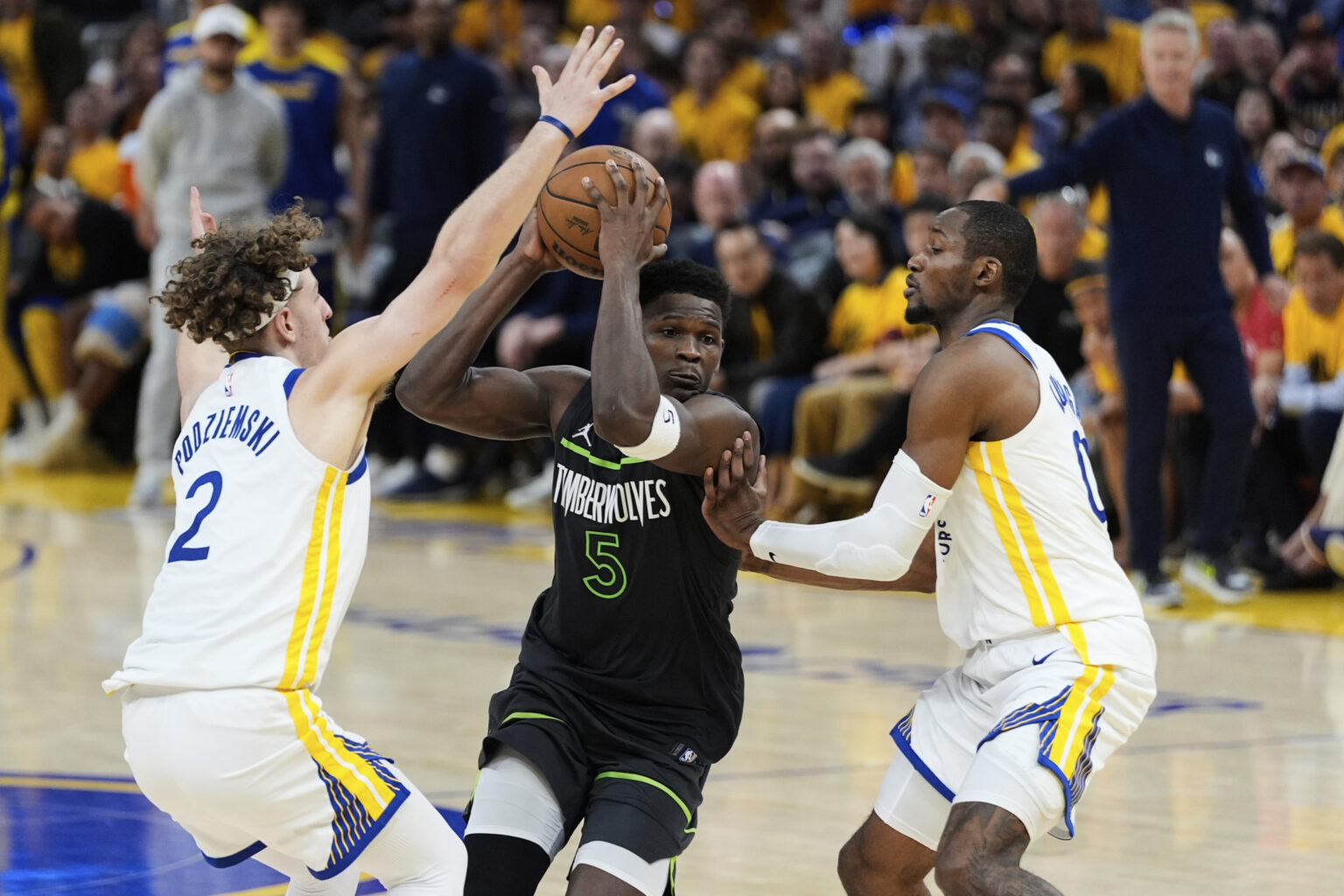 Edwards, Randle Lead Timberwolves to 102-97 Win Over Warriors (Photo: Minnesota Timberwolves guard Anthony Edwards, center, moves the ball between Golden State Warriors guard Brandin Podziemski (2) and forward Jonathan Kuminga during the second half of Game 3 of an NBA basketball second-round playoff series Saturday, May 10, 2025, in San Francisco. (AP Photo/Godofredo A. Vásquez)