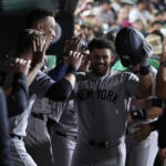 Jasson Dominguez Powers Yankees with Three Homers in 10-2 Win (Photo: New York Yankees' Jasson Domínguez, center, celebrates with teammates in the dugout after hitting a solo home run during the seventh inning of a baseball game against the Athletics, Friday, May 9, 2025, in West Sacramento, Calif. (AP Photo/Godofredo A. Vásquez)