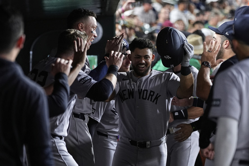 Jasson Dominguez Powers Yankees with Three Homers in 10-2 Win (Photo: New York Yankees' Jasson Domínguez, center, celebrates with teammates in the dugout after hitting a solo home run during the seventh inning of a baseball game against the Athletics, Friday, May 9, 2025, in West Sacramento, Calif. (AP Photo/Godofredo A. Vásquez)