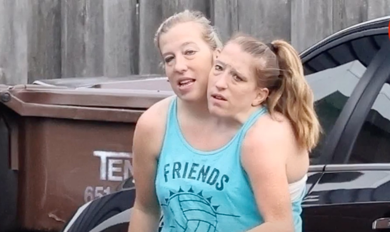 Conjoined Twins Abby and Brittany Hensel Seen with Husband and Dog