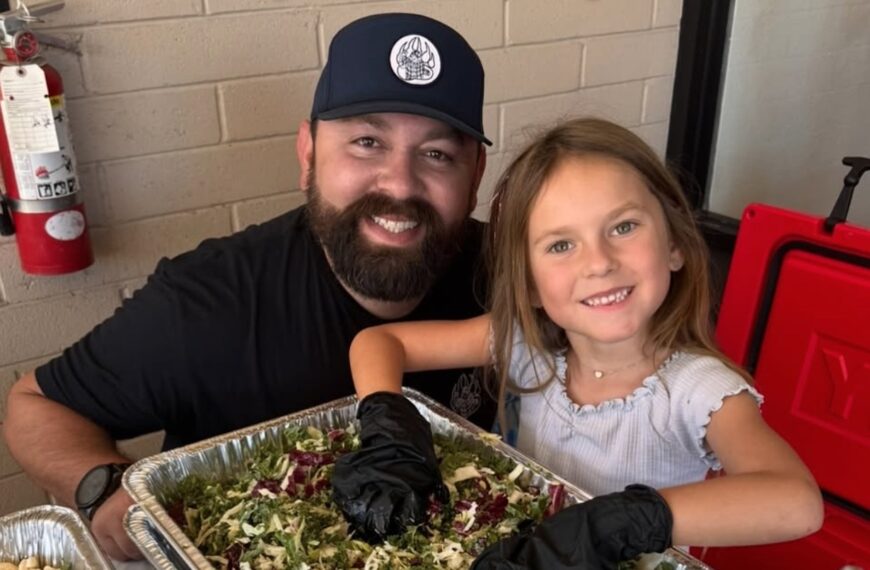 Michael Duarte cooking BBQ in his kitchen